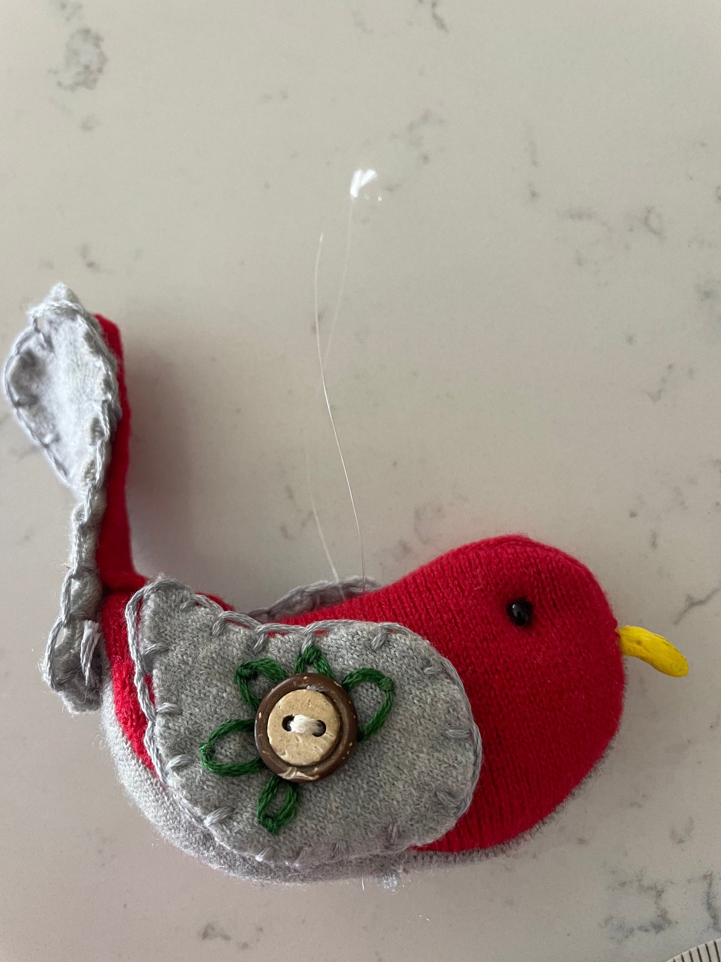 Buckeye bird (Red & Gray)ornament with a hand sewn buckeye on wings.Hang anywhere or sit on a shelf. It is said buckeyes are good-luck!